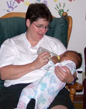 JPIC_2013_Grace Center_Chardon_Sister Mary Berrigan with infant