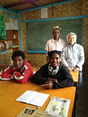 PNG_Teaching-in-the-Highlands-of-PNG_Benedicta_with-lang-students_01_w300