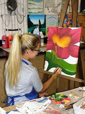 Art_Toledo:  IB Art student paints during class. 